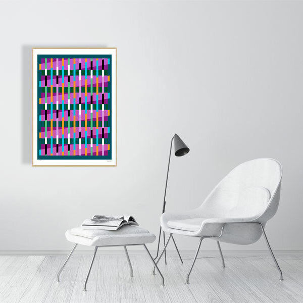 Modern interior featuring a vibrant Lux Series abstract print by Victoria Mardon, displayed on a white wall with minimalist white furniture.