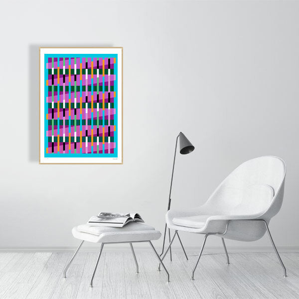 Modern interior featuring a vibrant Lux Series abstract print by Victoria Mardon, displayed on a white wall with minimalist white furniture.