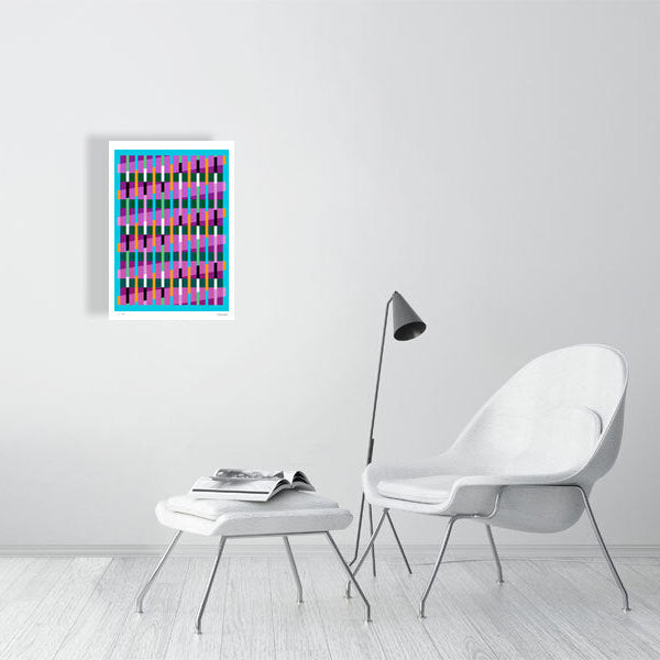 Modern interior featuring a vibrant Lux Series abstract print by Victoria Mardon, displayed on a white wall with minimalist white furniture.