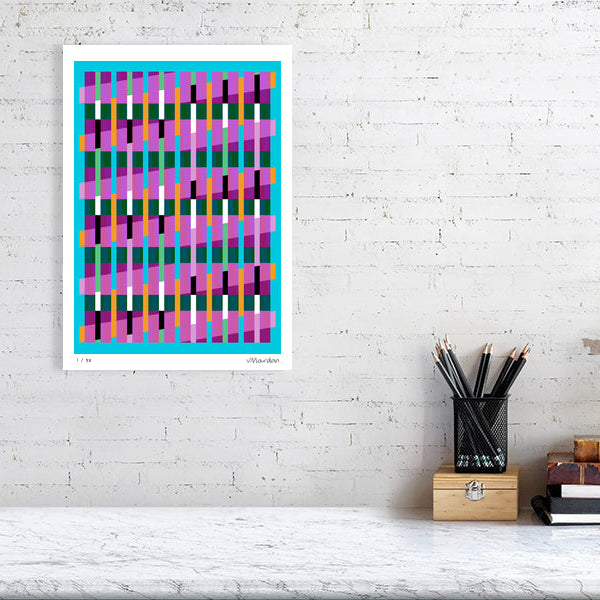Colourful Lux Series abstract print by Victoria Mardon on a white brick wall, styled with creative studio supplies below.