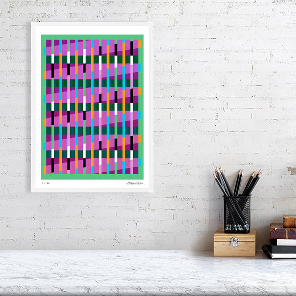 Colourful Lux Series abstract print by Victoria Mardon on a white brick wall, styled with creative studio supplies below.