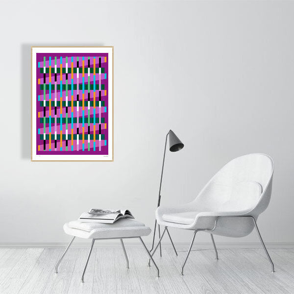 Modern interior featuring a vibrant Lux Series abstract print by Victoria Mardon, displayed on a white wall with minimalist white furniture.