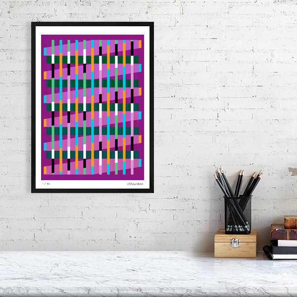 Colourful Lux Series abstract print by Victoria Mardon on a white brick wall, styled with creative studio supplies below