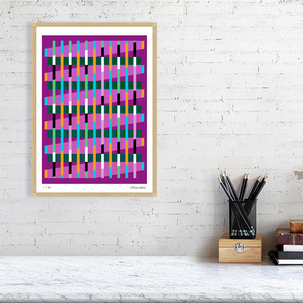 Colourful Lux Series abstract print by Victoria Mardon on a white brick wall, styled with creative studio supplies below