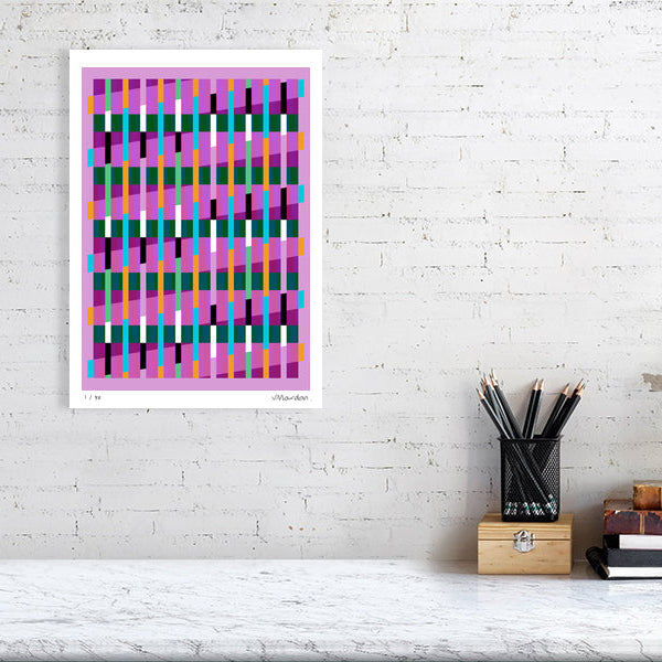 Colourful Lux Series abstract print by Victoria Mardon on a white brick wall, styled with creative studio supplies below