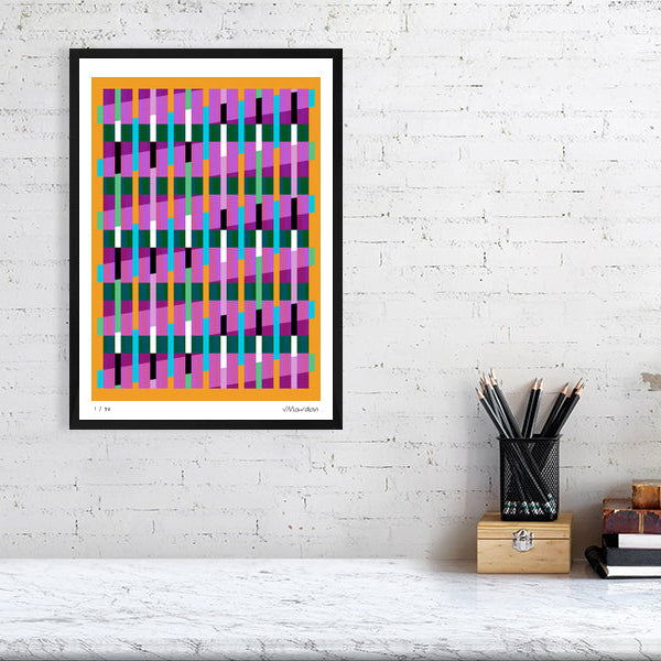 Colourful Lux Series abstract print by Victoria Mardon on a white brick wall, styled with creative studio supplies below.