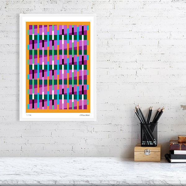 Colourful Lux Series abstract print by Victoria Mardon on a white brick wall, styled with creative studio supplies below.