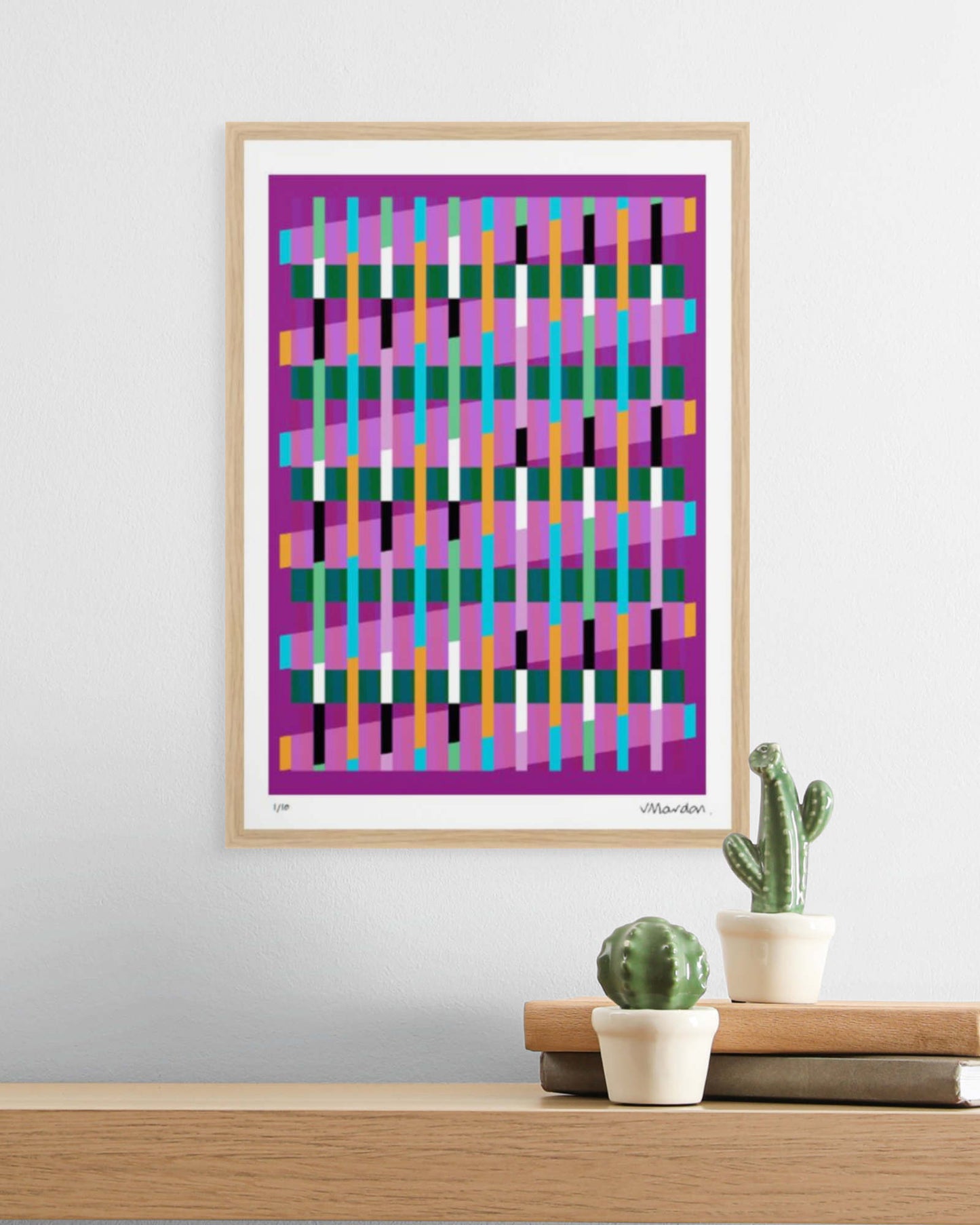 A3 oak-framed geometric abstract giclée print by Victoria Mardon displayed on a white wall above an oak shelf