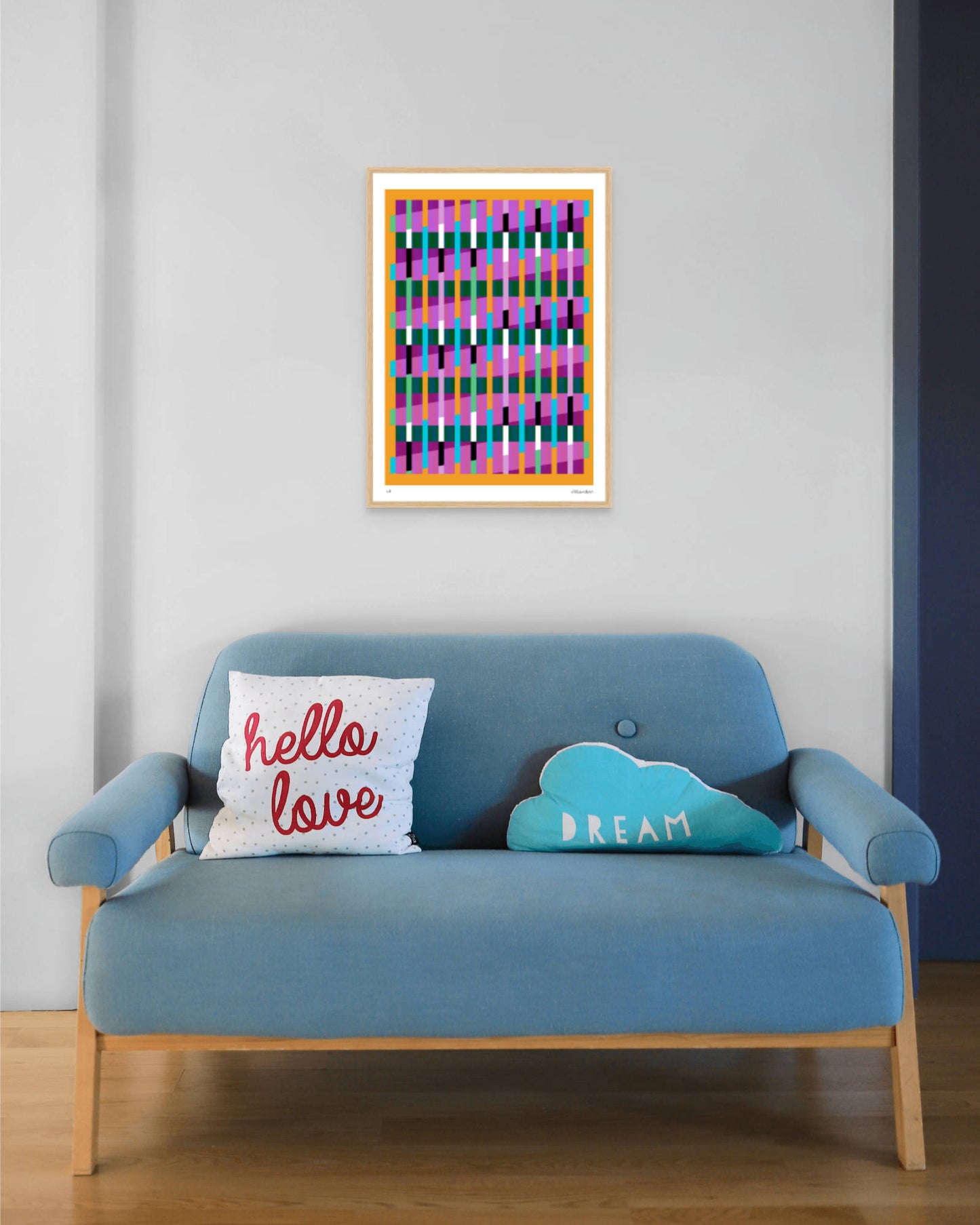 Yellow geometric abstract giclée print by Victoria Mardon in an oak frame displayed above a blue mid-century sofa