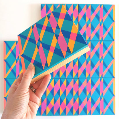 “B PG7/PB15:3 – PB15:3/PG7” – one module from Victoria Mardon’s B.E.L.O.N.G.I.N.G series held in front of the full artwork. Colourful geometric pattern on canvas, shown in context.