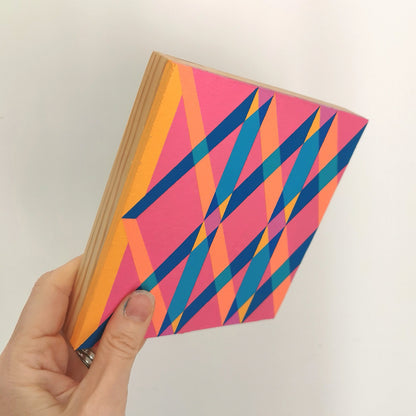 Hand holding “B PV19 PR122” – a small 15 x 15 cm canvas with a colourful geometric pattern. Part of Victoria Mardon’s B.E.L.O.N.G.I.N.G series, shown for scale.