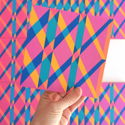 “G1 PV19 PR122” – one module from Victoria Mardon’s B.E.L.O.N.G.I.N.G series held in front of the full artwork. Colourful geometric pattern on canvas, shown in context.