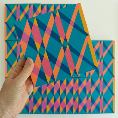 “L PG7/PB15:3 – PB15:3/PG7” – one module from Victoria Mardon’s B.E.L.O.N.G.I.N.G series held in front of the full artwork. Colourful geometric pattern on canvas, shown in context.