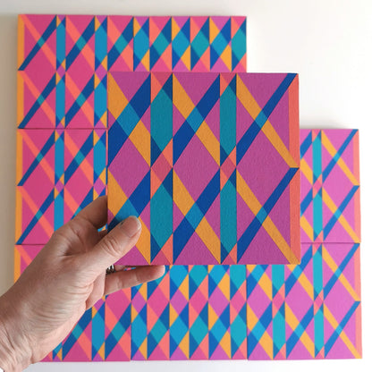 “L PV19 PR122” – one module from Victoria Mardon’s B.E.L.O.N.G.I.N.G series held in front of the full artwork. Colourful geometric pattern on canvas, shown in context.
