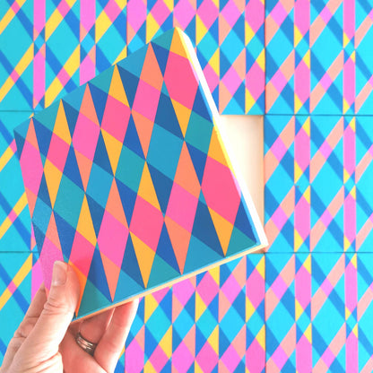 “N1 PG7/PB15:3 – PB15:3/PG7” – one module from Victoria Mardon’s B.E.L.O.N.G.I.N.G series held in front of the full artwork. Colourful geometric pattern on canvas, shown in context.