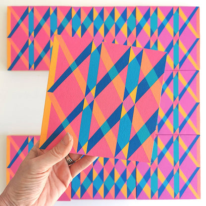 “O PV19 PR122” – one module from Victoria Mardon’s B.E.L.O.N.G.I.N.G series held in front of the full artwork. Colourful geometric pattern on canvas, shown in context.