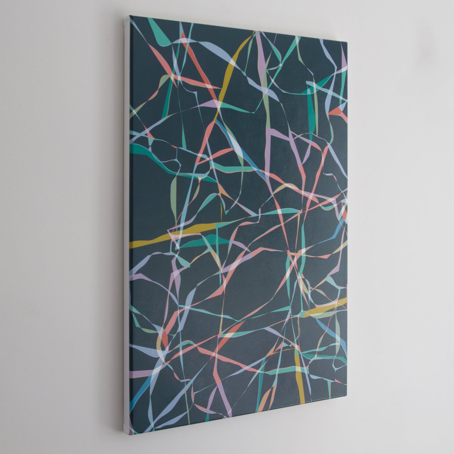 Side view of “Pace” – an abstract painting with twisting ribbons of colour on a dark background. The angled perspective reveals the paintings edges.