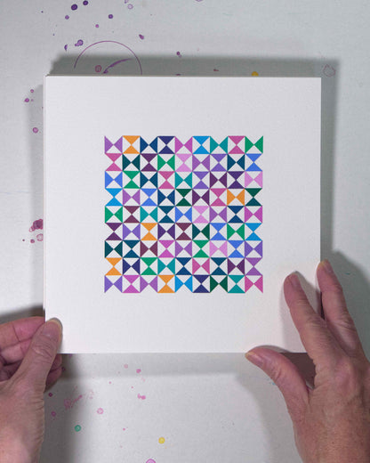 Hands holding a bold, graphic multicoloured abstract painting with repeating geometric shapes, 3 August – 034/365 (46237/365) by Victoria Mardon, 365: A Year in Colour series.