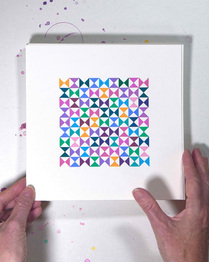 Hands holding a bold, graphic multicoloured abstract painting with repeating geometric shapes, 3 July – 003/365 (46206/365) by Victoria Mardon, 365: A Year in Colour series.