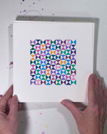 Hands holding a bold, graphic multicoloured abstract painting with repeating geometric shapes, 6 July – 006/365 (46209/365) by Victoria Mardon, 365: A Year in Colour series.