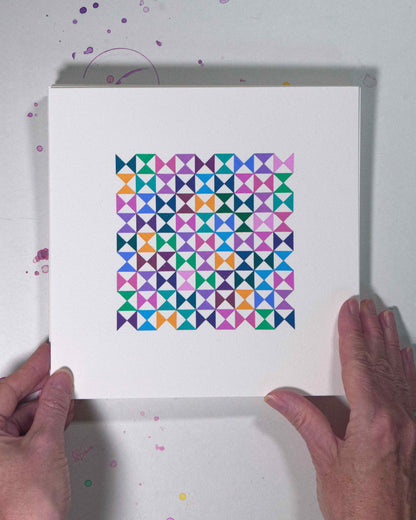 Hands holding a bold, graphic multicoloured abstract painting with repeating geometric shapes, 7 August – 038/365 (46241/365) by Victoria Mardon, 365: A Year in Colour series.