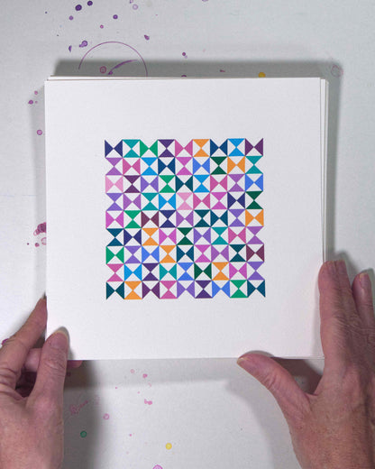 Hands holding a bold, graphic multicoloured abstract painting with repeating geometric shapes, 8 July – 008/365 (46211/365) by Victoria Mardon, 365: A Year in Colour series.