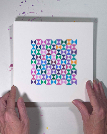 Hands holding a bold, graphic multicoloured abstract painting with repeating geometric shapes, 9 August – 040/365 (46243/365) by Victoria Mardon, 365: A Year in Colour series.
