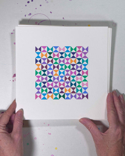 Hands holding a bold, graphic multicoloured abstract painting with repeating geometric shapes, 9 July – 009/365 (46212/365) by Victoria Mardon, 365: A Year in Colour series.