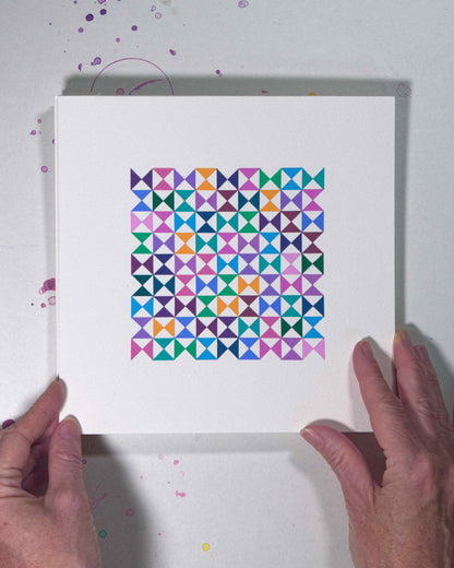 Hands holding a bold, graphic multicoloured abstract painting with repeating geometric shapes, 12 August – 043/365 (46246/365) by Victoria Mardon, 365: A Year in Colour series.