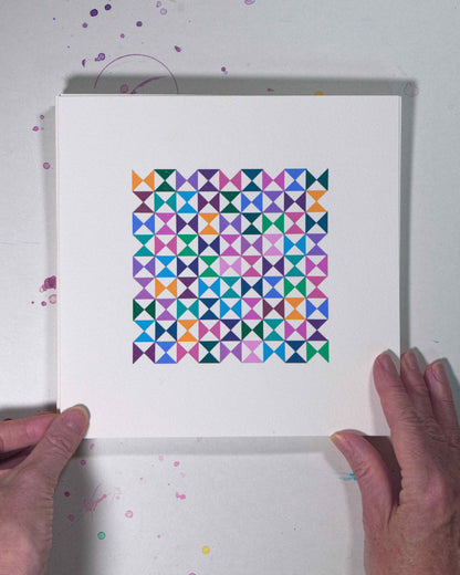Hands holding a bold, graphic multicoloured abstract painting with repeating geometric shapes, 13 August – 044/365 (46247/365) by Victoria Mardon, 365: A Year in Colour series.