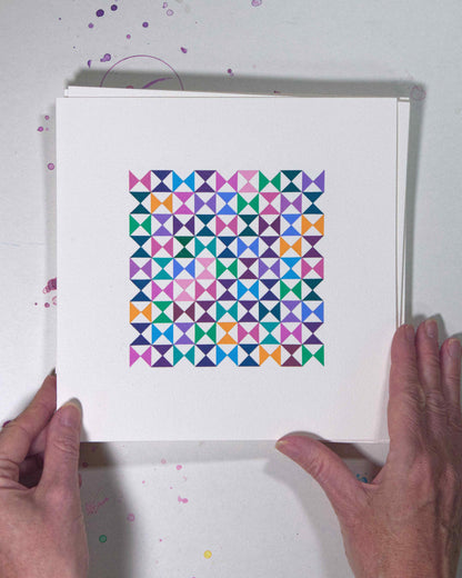 Hands holding a bold, graphic multicoloured abstract painting with repeating geometric shapes, 14 July – 014/365 (46217/365) by Victoria Mardon, 365: A Year in Colour series.