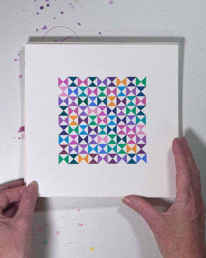Hands holding a bold, graphic multicoloured abstract painting with repeating geometric shapes, 15 July – 015/365 (46218/365) by Victoria Mardon, 365: A Year in Colour series.