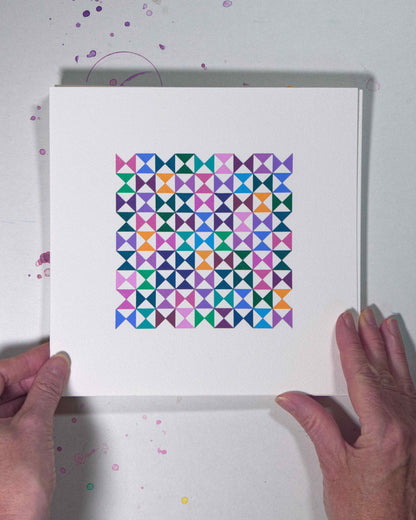 Hands holding a bold, graphic multicoloured abstract painting with repeating geometric shapes, 17 August – 048/365 (46251/365) by Victoria Mardon, 365: A Year in Colour series.