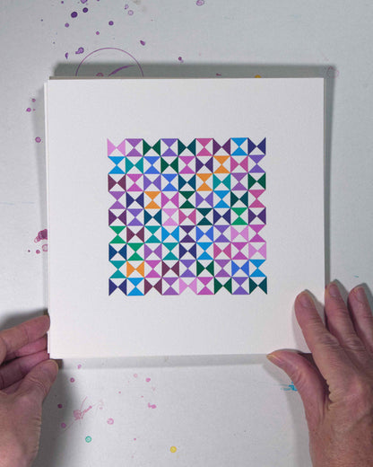 Hands holding a bold, graphic multicoloured abstract painting with repeating geometric shapes, 18 August – 049/365 (46252/365) by Victoria Mardon, 365: A Year in Colour series.