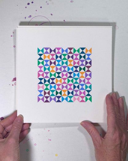 Hands holding a bold, graphic multicoloured abstract painting with repeating geometric shapes, 19 July – 019/365 (46222/365) by Victoria Mardon, 365: A Year in Colour series.