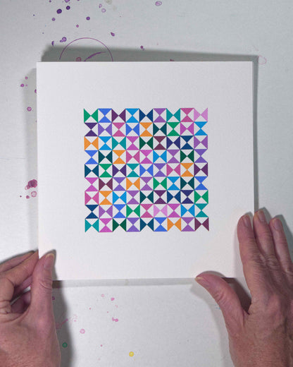 Hands holding a bold, graphic multicoloured abstract painting with repeating geometric shapes, 20 August – 051/365 (46254/365) by Victoria Mardon, 365: A Year in Colour series.