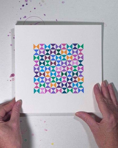 Hands holding a bold, graphic multicoloured abstract painting with repeating geometric shapes, 21 August – 052/365 (46255/365) by Victoria Mardon, 365: A Year in Colour series.