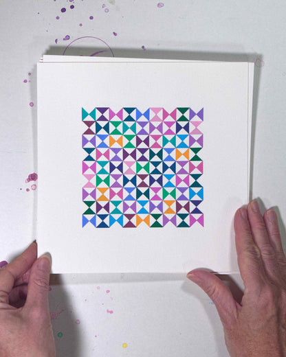 Hands holding a bold, graphic multicoloured abstract painting with repeating geometric shapes, 21 July – 021/365 (46224/365) by Victoria Mardon, 365: A Year in Colour series.