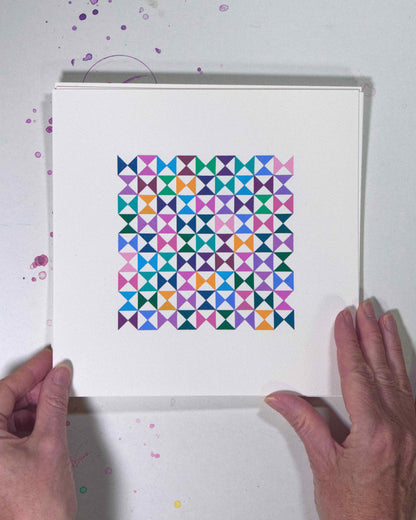 Hands holding a bold, graphic multicoloured abstract painting with repeating geometric shapes, 23 July – 023/365 (46226/365) by Victoria Mardon, 365: A Year in Colour series.