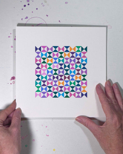 Hands holding a bold, graphic multicoloured abstract painting with repeating geometric shapes, 25 August – 056/365 (46259/365) by Victoria Mardon, 365: A Year in Colour series.