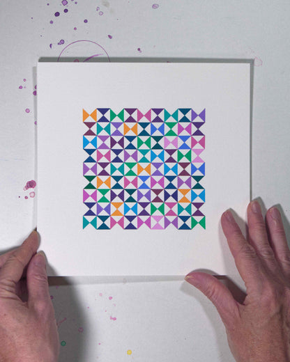 Hands holding a bold, graphic multicoloured abstract painting with repeating geometric shapes, 26 August – 057/365 (46260/365) by Victoria Mardon, 365: A Year in Colour series.