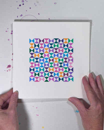 Hands holding a bold, graphic multicoloured abstract painting with repeating geometric shapes, 26 July – 026/365 (46229/365) by Victoria Mardon, 365: A Year in Colour series.