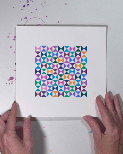 Hands holding a bold, graphic multicoloured abstract painting with repeating geometric shapes, 28 July – 028/365 by Victoria Mardon, 365: A Year in Colour series.