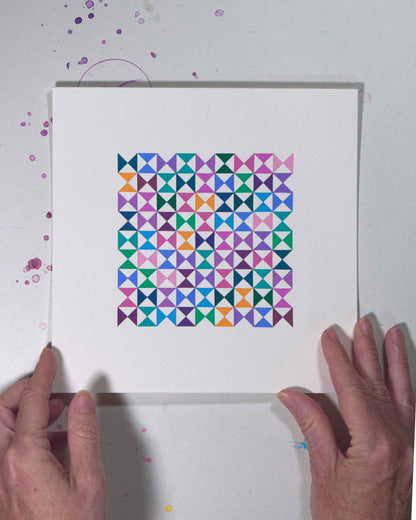Hands holding a bold, graphic multicoloured abstract painting with repeating geometric shapes, 29 July – 029/365 by Victoria Mardon, 365: A Year in Colour series.