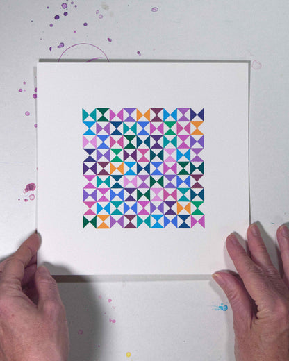 Hands holding a bold, graphic multicoloured abstract painting with repeating geometric shapes, 30 August – 061/365 (46264/365) by Victoria Mardon, 365: A Year in Colour series.