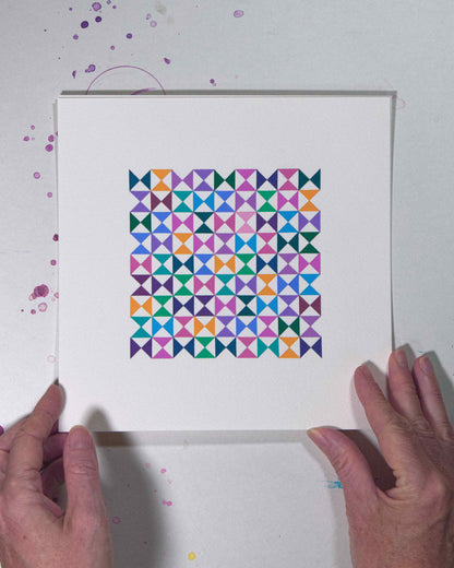 Hands holding a bold, graphic multicoloured abstract painting with repeating geometric shapes, 30 July – 030/365 by Victoria Mardon, 365: A Year in Colour series.