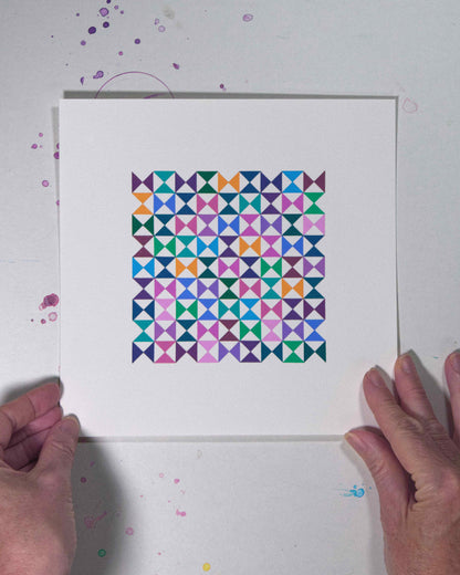 Hands holding a bold, graphic multicoloured abstract painting with repeating geometric shapes, 31 August – 062/365 (46265/365) by Victoria Mardon, 365: A Year in Colour series.