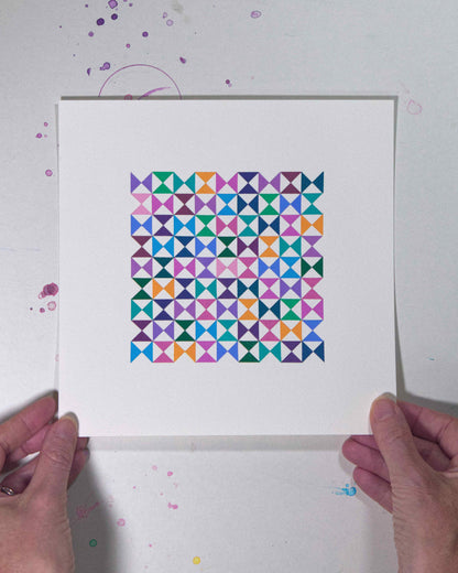Hands holding a bold, graphic multicoloured abstract painting with repeating geometric shapes, 31 July – 031/365 by Victoria Mardon, 365: A Year in Colour series.
