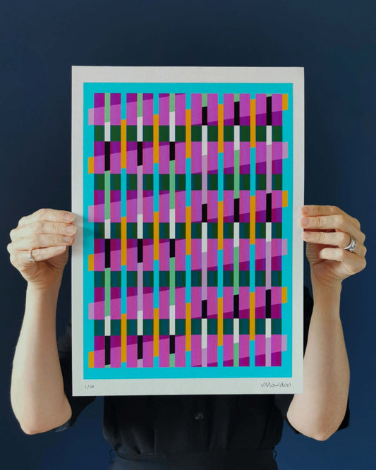 Blue geometric abstract giclée print by Victoria Mardon held in hands against a dark background