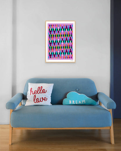 Pink geometric abstract giclée print by Victoria Mardon in an oak frame displayed above a blue mid-century sofa